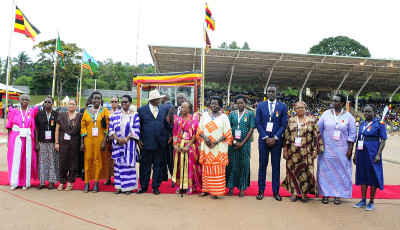 Commissioner Teopista Birungi Mayanja stands for a photo with President Yoweri Kaguta Museveni and her fellow award recipients. 