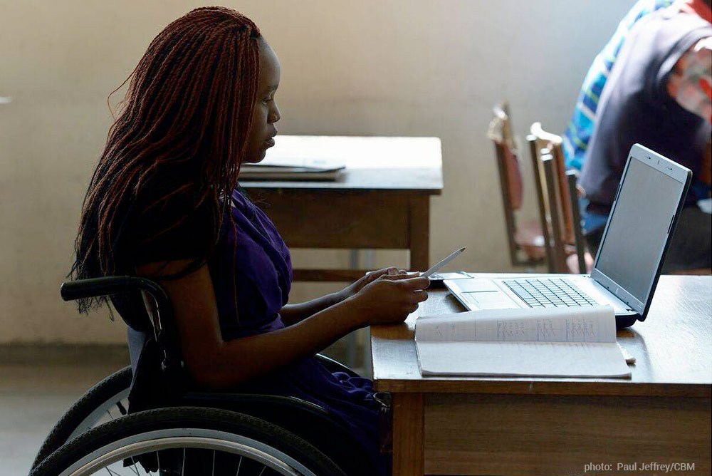 student in wheelchair at computer